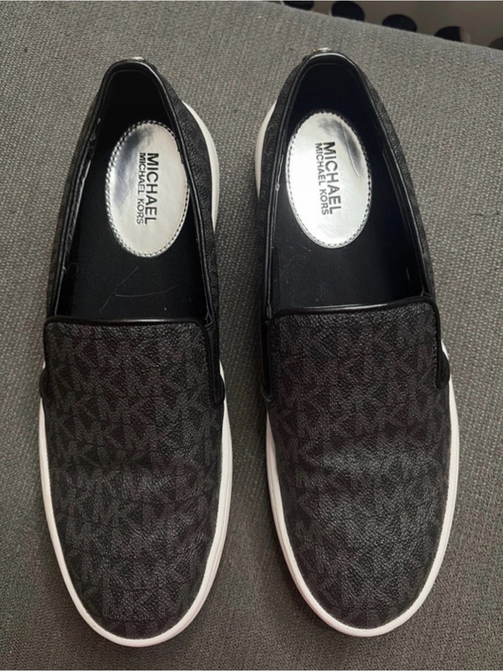 Michael Kors women’s Black Logo Slip-On Sneakers